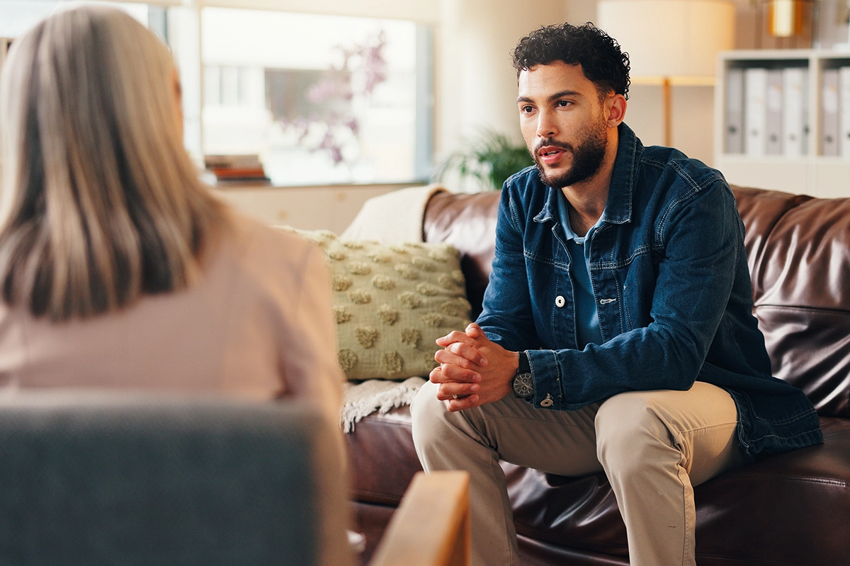 A man sits in a coaching session